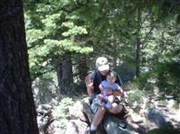 Being held by 'Uncle' Dave on Mt Elden